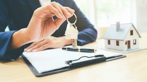 REALTOR holding keys to new home